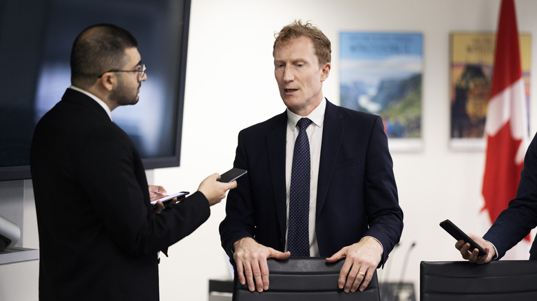 Canadian Minister Marc Miller being interviewed .