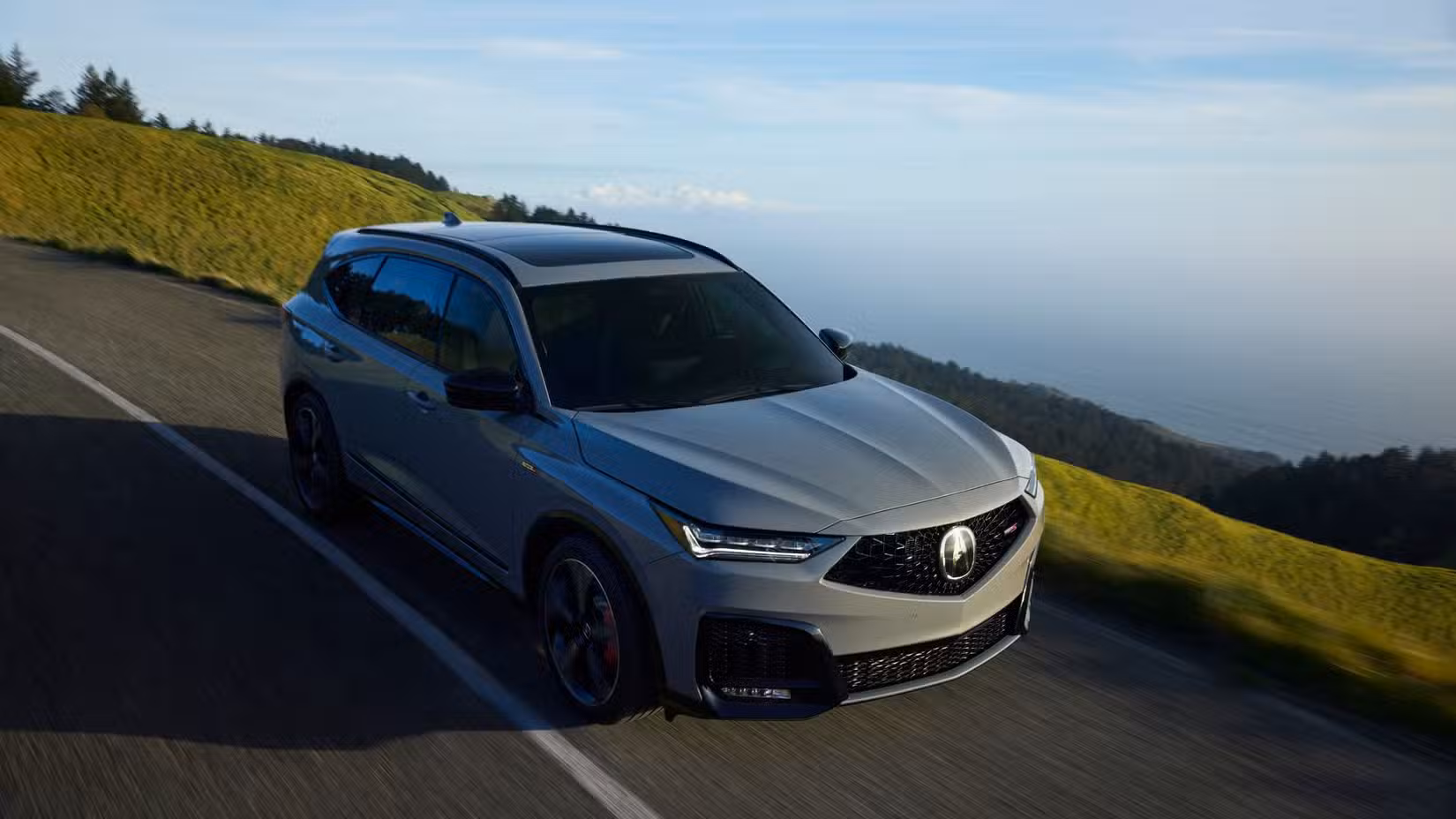Dynamic view of a gray 2025 Acura MDX Type S.