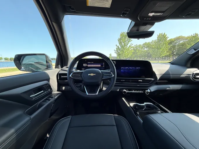 A screen shows information inside an electric pickup truck.