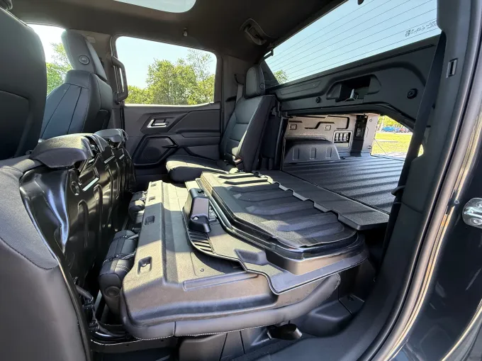 A partition separates the cabin from the bed of the truck.
