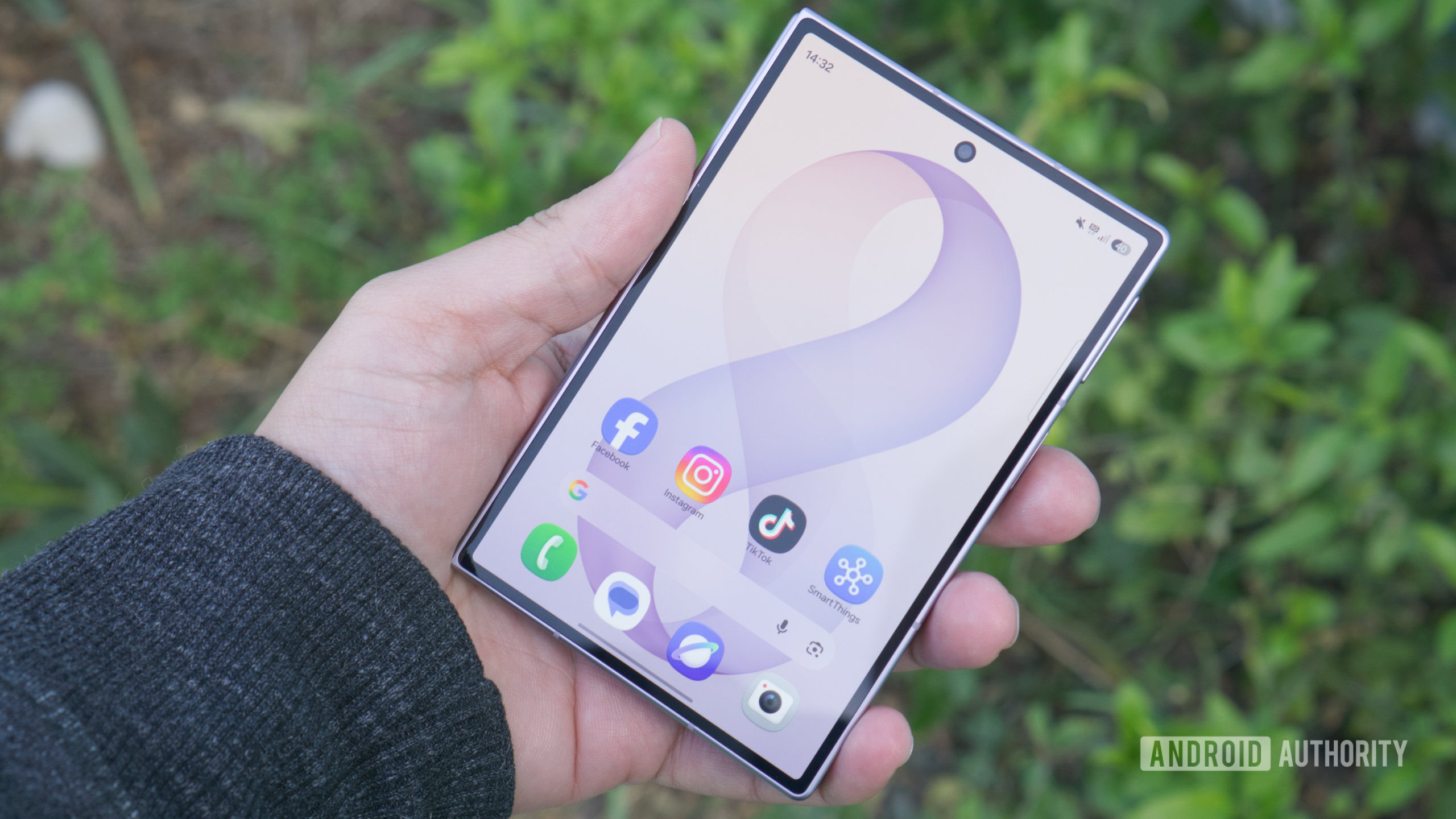 Samsung Galaxy Z Fold 8 in hand showing cover screen scaled